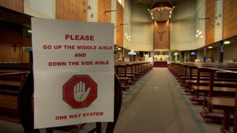 A sign directing people located inside a church