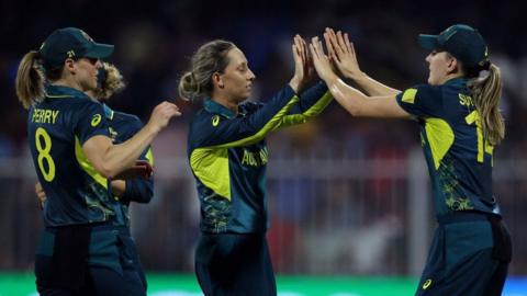 Australia players celebrate a wicket