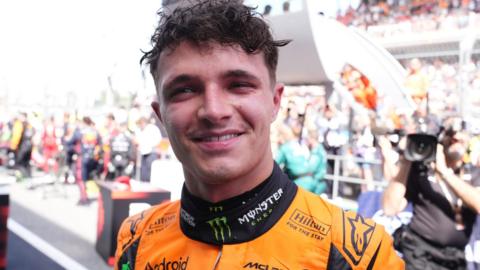 Lando Norris smiles at the camera after finishing second in the Spanish Grand Prix