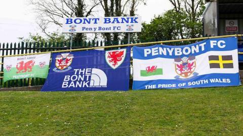 Penybont FC flags displayed at a game