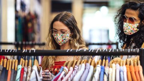 Stock image of two people shopping in a charity shop