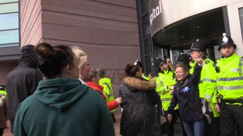 Protesters try to storm hospital