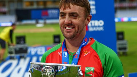 Lewis Hill with the One-Day Cup trophy