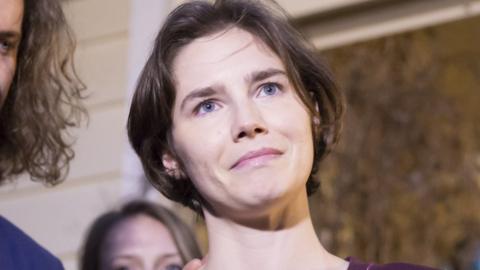 Amanda Knox, pictured here in 2015, looks to the side of the camera