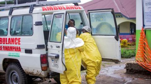 Congolese health workers receive a patient at the Rwampara General Hospital 