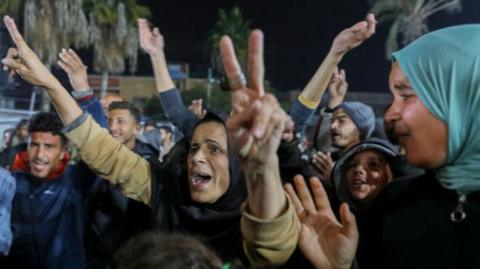 A crowd of Palestinians celebrate in Gaza