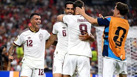 Mikel Merino #6 of Spain celebrates with teammates after scoring his team's first goal 