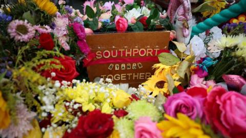 Flowers gathered in tribute following the Southport attack in September 2024