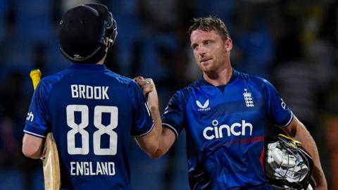 Jos Buttler and Harry Brook celebrate victory