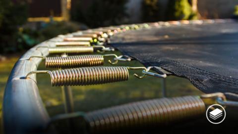 A photograph of the springs on a trampoline. 
