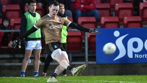 Rory Beggan kicks Scotstown's winning free against Kilcoo at Pairc Esler