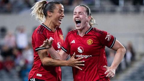  Elisabeth Terland of Manchester United celebrates with teammate Celin Bizet