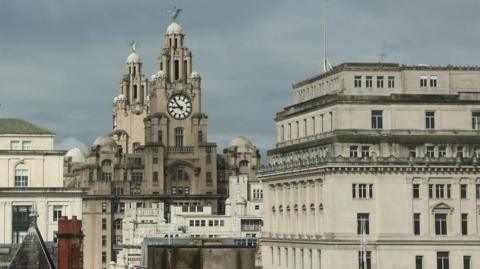 Liverpool skyline from inland showing the Liver Building and other buildings around the city centre.