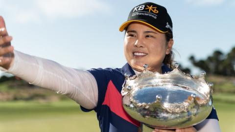 Inbee Park smiling with the trophy