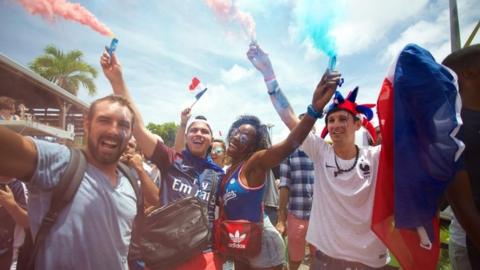 People celebrate after France won the Russia 2018 World Cup final football match against Croatia, on 15 July 2018 in Le Gosier on the French overseas Caribbean island of Guadeloupe