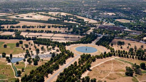 An aerial view of Hampton Court Palace and Bushy Park in East Molesey, Surrey