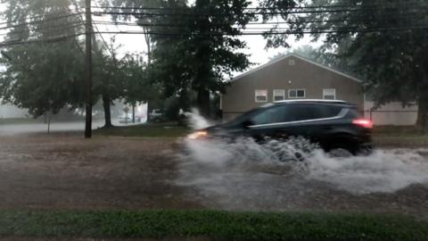 Car drives through water