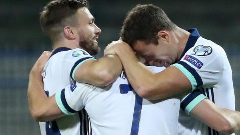 Jonny Evans (right) and Stuart Dallas (left) celebrate with Niall McGinn after he equalised in Thursday's Euro 2020 play-off win over Bosnia-Herzegovina
