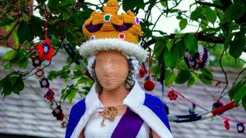 A life size knitted Queen in the village of Holmes Chapel