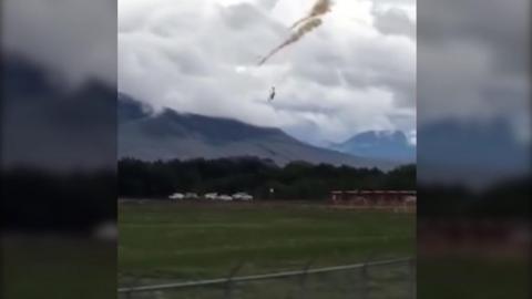 A pilot ejects from the aircraft