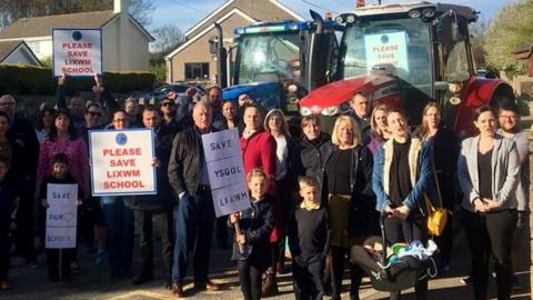 A protest, with tractors, outside Lixwm Primary
