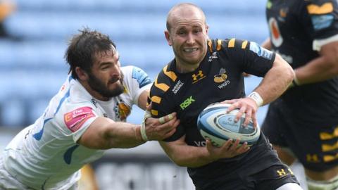 Wasps' Dan Robson escapes the tackle of Exeter's Don Armand