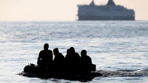 A boat carrying migrants in the English Channel