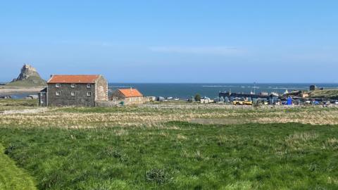 Looking across the harbour to Lindisfarne castle on Holy Island