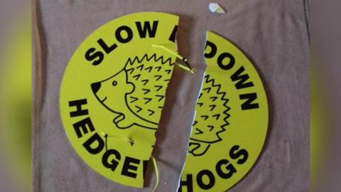 A broken hedgehog sign