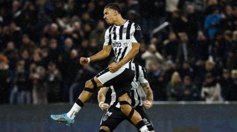 Ruben Roosken jumping in the air in celebration after scoring for Heracles Almelo