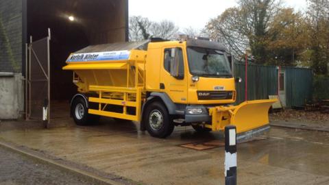 A yellow gritter at depot