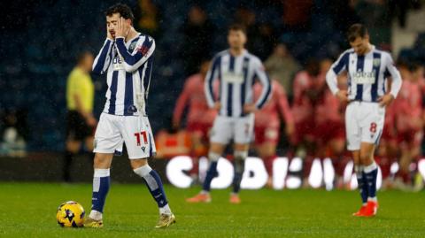 West Brom players look dejected