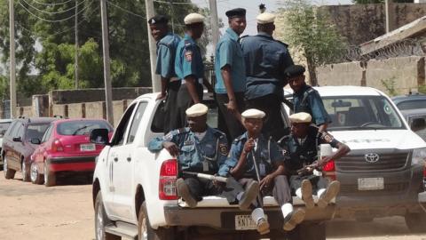 A group of Hisbah police officers sitting in the back of a vehicle. Photo from 2013