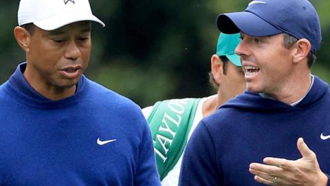 Tiger Woods and Rory McIlroy chat during a practice round at Augusta National