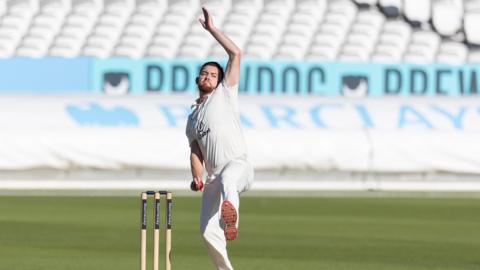 Ryan Higgins in mid-delivery stride bowling for Middlesex against Gloucestershire at Lord's last season