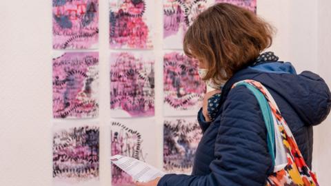 A woman at an arts exhibition at the Piazza in Huddersfield