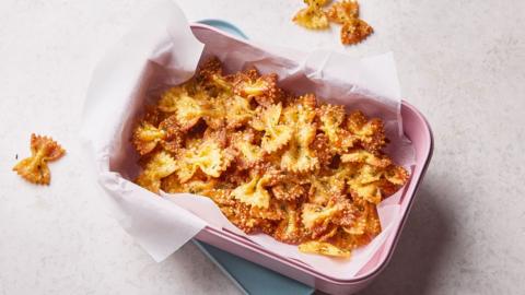 Crispy pasta bows in a reusable container