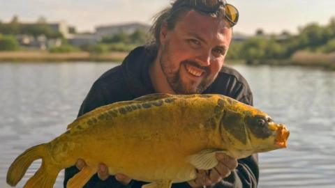 Man with big fish