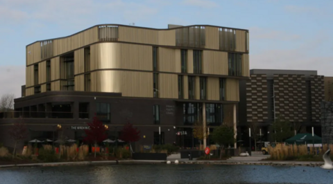 Telford's Southwater One building, a curved-sided metallic building standing behind a lake