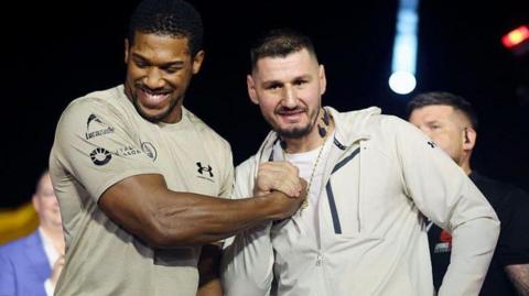 Anthony Joshua and Kristian Prenga shake hands