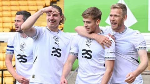 Port Vale players celebrate a goal against Bromley
