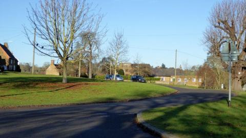 A view of Badby village green on a clear day.