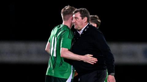 Tommy Wright celebrates with Terry Devlin