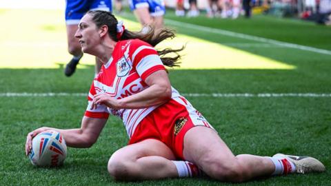 Rachael Woosey dotting down to score a try for St Helens.