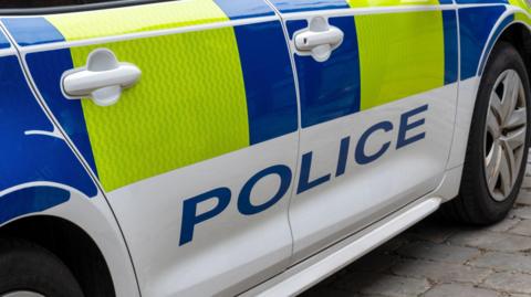 Police car parked on pavement