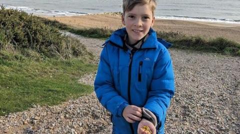 Huw on a beach