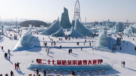 In an aerial view, tourists view ice sculptures at the 27th Harbin Ice-Snow World on December 17, 2025 in Harbin, Heilongjiang Province of China.