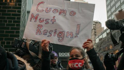 Demonstrators call on New York Gov. Andrew Cuomo to resign at a rally on March 2, 2021 in New York City.