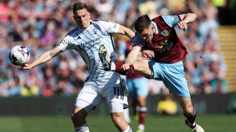 Chris Wood and Dara O'Shea battle for the ball last season.