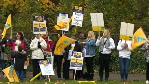 Teaching assistants protest at a roadside